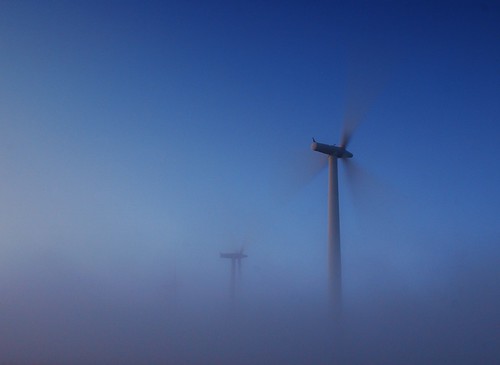 Windmills in fog